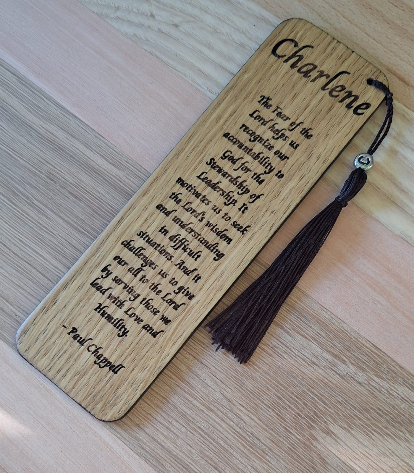 Hand-engraved oak bookmark with leather tassel
