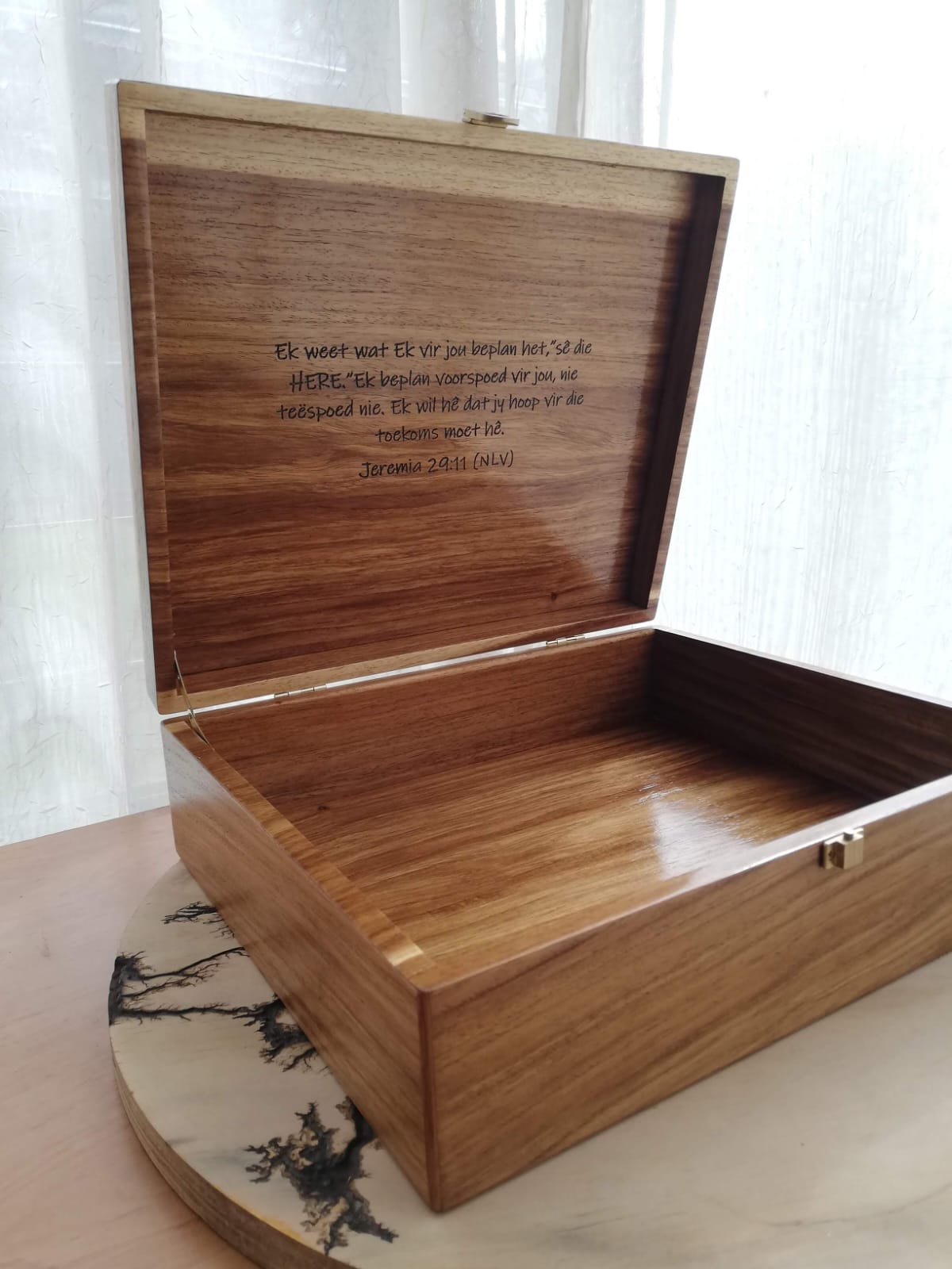 Engraved wooden keepsake box with ornate lid