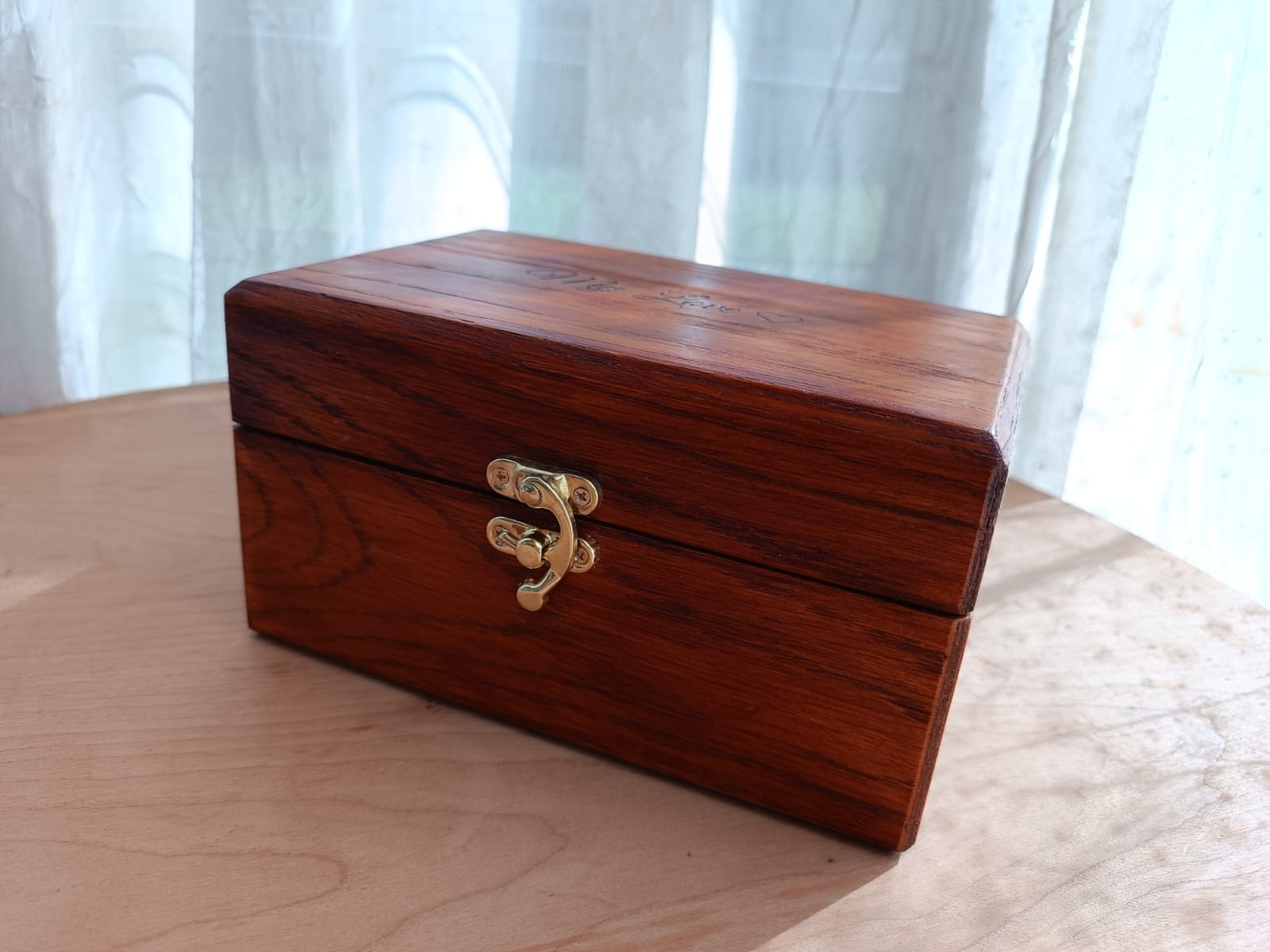 Engraved wooden keepsake chest with brass accents