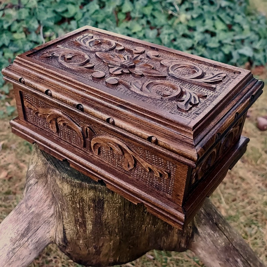 Vintage wooden treasure box with brass latch